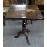 AN ANTIQUE MAHOGANY TRIPOD TABLE WITH OBLONG TOP