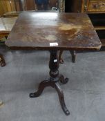 AN ANTIQUE MAHOGANY TRIPOD TABLE WITH OBLONG TOP