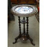 A LATE NINETEENTH CENTURY STAINED BEECH OCCASIONAL TABLE INSET WITH CHINA PLATE