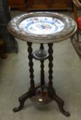 A LATE NINETEENTH CENTURY STAINED BEECH OCCASIONAL TABLE INSET WITH CHINA PLATE