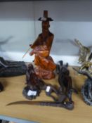 AN ORIENTAL CARVED WOOD FIGURE OF A DEITY, 7" HIGH; A WOODEN STAND; A CHINESE CARVED SOFTWOOD FIGURE