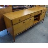 A TEAK SIDEBOARD WITH FOUR DRAWERS OVER FOUR CUPBOARDS (A.F.)