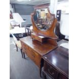 AN EDWARDIAN INLAID MAHOGANY DRESSING TABLE WITH SHIELD SHAPED MIRROR, TWO OVER THREE DRAWERS AND