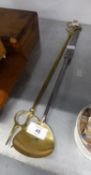 AN ANTIQUE LONG HANDLED STEEL LADLE WITH ROUND  BRASS BOWL AND AN OLD BRASS TOASTING FORK