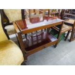 A TWO TIER TEA TROLLEY/COFFEE TABLE