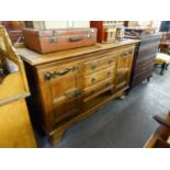 ARTS AND CRAFTS OAK LARGE SIDEBOARD, HAVING THREE DRAWERS BETWEEN CUPBOARD DOORS