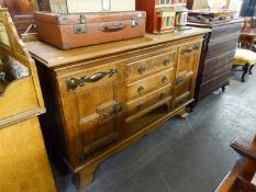 ARTS AND CRAFTS OAK LARGE SIDEBOARD, HAVING THREE DRAWERS BETWEEN CUPBOARD DOORS