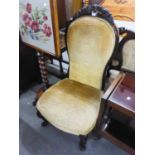 ANTIQUE MAHOGANY UPHOLSTERED NURSING CHAIR HAVING CARVED DETAIL