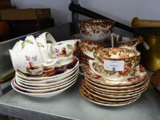 FOUR NINETEENTH CENTURY GAUDY WELSH CHINA FORAL PATTERN TEA CUPS AND SAUCERS IN TYPICAL COLOURS