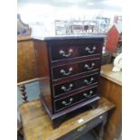 MAHOGANY REPRODUCTION SMALL CHEST OF FOUR DRAWERS ON BRACKET FEET