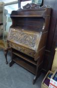 GOOD QUALITY CARVED OAK BUREAU, HAVING OPEN SHELVES