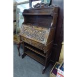 GOOD QUALITY CARVED OAK BUREAU, HAVING OPEN SHELVES