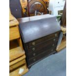 A MAHOGANY BUREAU WITH FOUR GRADUATED LONG DRAWERS BELOW, ON BRACKET FEET