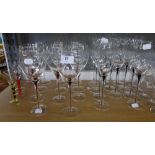 SET OF 11 GLASS TALL WINE GOBLETS, THE SLENDER DRAWN STEMS WITH RED TEAR INCLUSIONS, SET OF 11