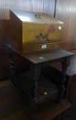 AN OAK OCCASIONAL TABLE WITH SPIRAL LEGS AND A SMALL STATIONERY CUPBOARD WITH DRAWER (2)