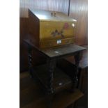 AN OAK OCCASIONAL TABLE WITH SPIRAL LEGS AND A SMALL STATIONERY CUPBOARD WITH DRAWER (2)