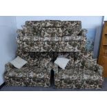 A LOUNGE SUITE OF FOUR PIECES, COVERED IN BROWN AND FLORAL PRINTED LINEN, VIZ A PAIR OF TWO SEATER