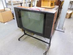 BANG AND OLUFSEN 'BEOVISION LX2500' COLOUR TELEVISION ON STAND, HAVING REMOTE CONTROL AND TWO