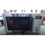 A SHARP STAINLESS STEEL CASED MICROWAVE