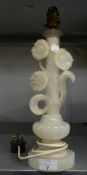 A FLORAL CARVED WHITE ALABASTER TABLE LAMP