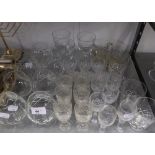 A SET OF SIX WELL-CUT GLASS SHERRY GLASSES AND SEVEN CUT GLASS BRANDY BALLOONS AND FIFTEEN VARIOUS