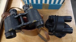 A PAIR OF FIELD BINOCULARS IN LEATHER CASE AND A PAIR OF MODERN FOLD-AWAY BINOCULARS (2)