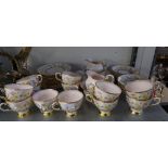 A TUSCAN PINK FLORAL CHINTZ TEA SET FOR 12 PERSONS, CONSISTING; OF TWO CAKE/SANDWICH PLATES, TWO