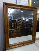 A PINE FRAMED WALL MIRROR