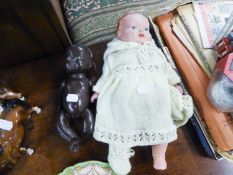 COMPOSITION BLACK BABY DOLL with fixed eyes and moveable limbs, 9 ½? high, (a/f), together with