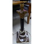 A BLACK ENAMELLED AND BRASS CORONTHIAN COLUMN TABLE LAMP, ON SQUARE STEPPED BASE, 14 3/4" HIGH AND