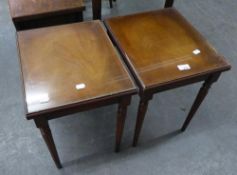 A PAIR OF MAHOGANY OBLONG COFFEE TABLES WITH GLASS PROTECTORS