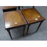 A PAIR OF MAHOGANY OBLONG COFFEE TABLES WITH GLASS PROTECTORS