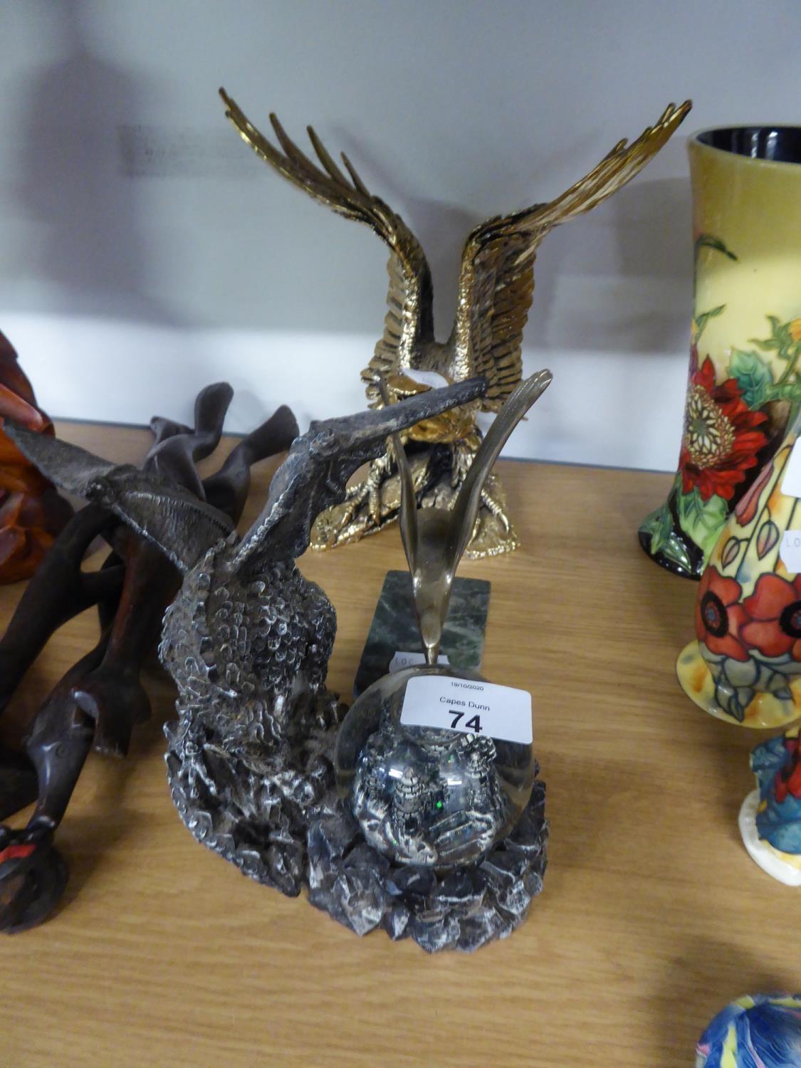 A GILT FINISH RESIN MODEL OF AN EAGLE AND A METAL CAR MASCOT STYLE MODEL OF AN EAGLE, ON MARBLE