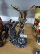 A GILT FINISH RESIN MODEL OF AN EAGLE AND A METAL CAR MASCOT STYLE MODEL OF AN EAGLE, ON MARBLE