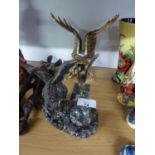 A GILT FINISH RESIN MODEL OF AN EAGLE AND A METAL CAR MASCOT STYLE MODEL OF AN EAGLE, ON MARBLE