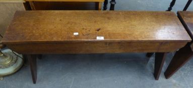 A PAIR OF EARLY TWENTIETH CENTURY OAK BENCHES WITH PANEL SEATS, PLAIN APRONS ON INVERTED 'V'