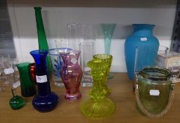 SIXTEEN VASES, MAINLY OF COLOURED GLASS; VICTORIAN YELLOW MOULDED GLASS CANDLESTICKS AND A GLASS JAR