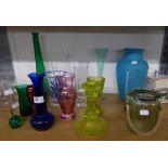 SIXTEEN VASES, MAINLY OF COLOURED GLASS; VICTORIAN YELLOW MOULDED GLASS CANDLESTICKS AND A GLASS JAR