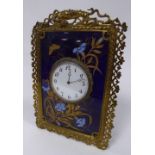 ORNATE LATE VICTORIAN BRASS AND CERAMIC TILE STRUT CLOCK, of oblong form, the 3 ½? enamelled