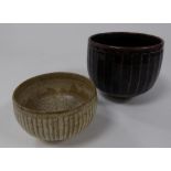 TWO STUDIO POTTERY FLUTED BOWLS BY DAVID LEACH, of steep sided, footed form, one with temmoku glaze,