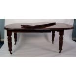 VICTORIAN MAHOGANY WIND-OUT EXTENDING DINING TABLE WITH TWO ADDITIONAL LEAVES, the D end top above a