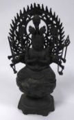 TWENTIETH CENTURY CHINESE BRONZE FIGURE OF KANNON WITH SIXTEEN ARMS, modelled seated on a lotus