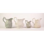 FOUR RELIEF MOULDED POTTERY JUGS, comprising: an UNMARKED BLUE GLAZED ?;SMOKING PARTY? and ?CARD