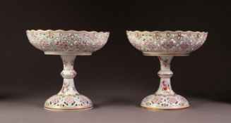 PAIR OF TWENTIETH CENTURY DRESDEN PIERCED PORCELAIN TAZZAS, each of typical form, painted in tones