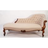 GOOD VICTORIAN CARVED WALNUT CHAISE LONGUE, the shaped and buttoned back with scroll carved