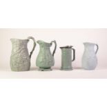 FOUR BLUE GLAZED FOLIATE MOULDED POTTERY JUGS, comprising: BROWNFIELD & SON, ?SISYPHUS? JUG WITH