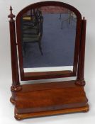 VICTORIAN FIGURED MAHOGANY LARGE TOILET MIRROR, of typical form with arch topped plate, tapering