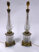 PAIR OF MODERN GILT METAL MOUNTED DIAMOND CUT GLASS TABLE LAMPS, RETAILED BY HARRODS, each of