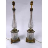 PAIR OF MODERN GILT METAL MOUNTED DIAMOND CUT GLASS TABLE LAMPS, RETAILED BY HARRODS, each of