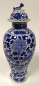 CHINESE BLUE AND WHITE PORCELAIN VASE AND COVER, of slender ovoid form with dog of fo finial to